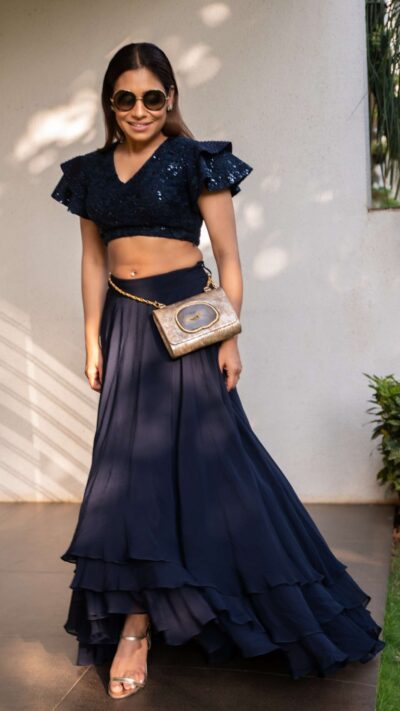 Voluminous layered skirt paired with dramatic embroidered crop top